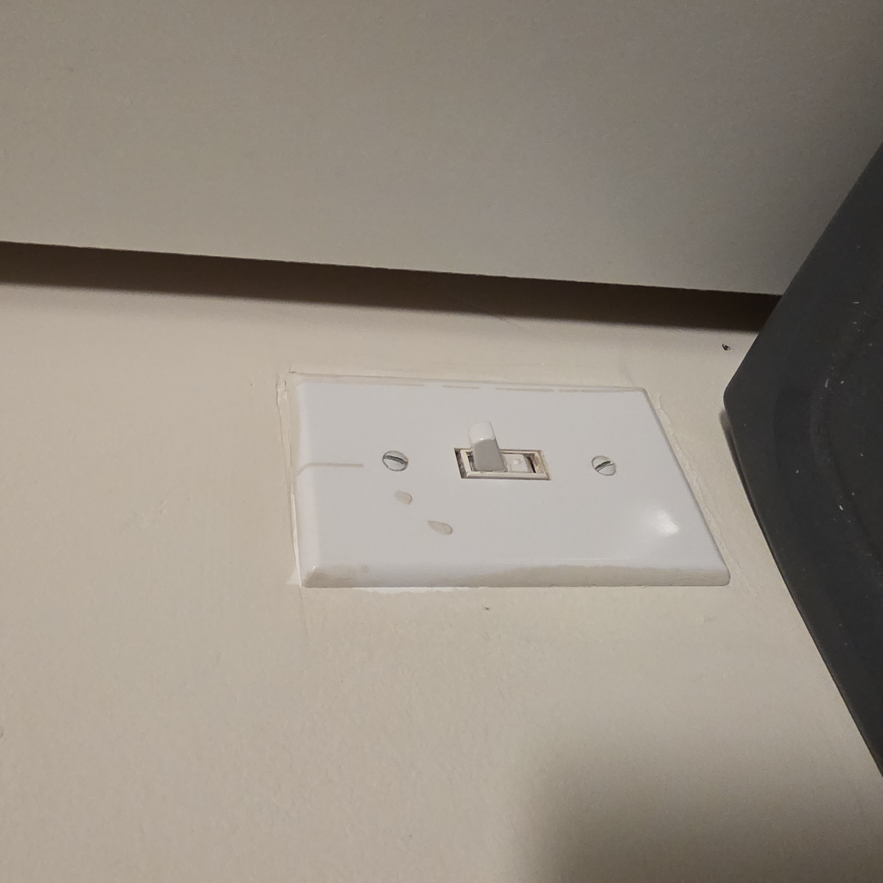 Flipping a light switch is an example of Environment-Based Interaction because it involves interaction with a fixed wall interface.