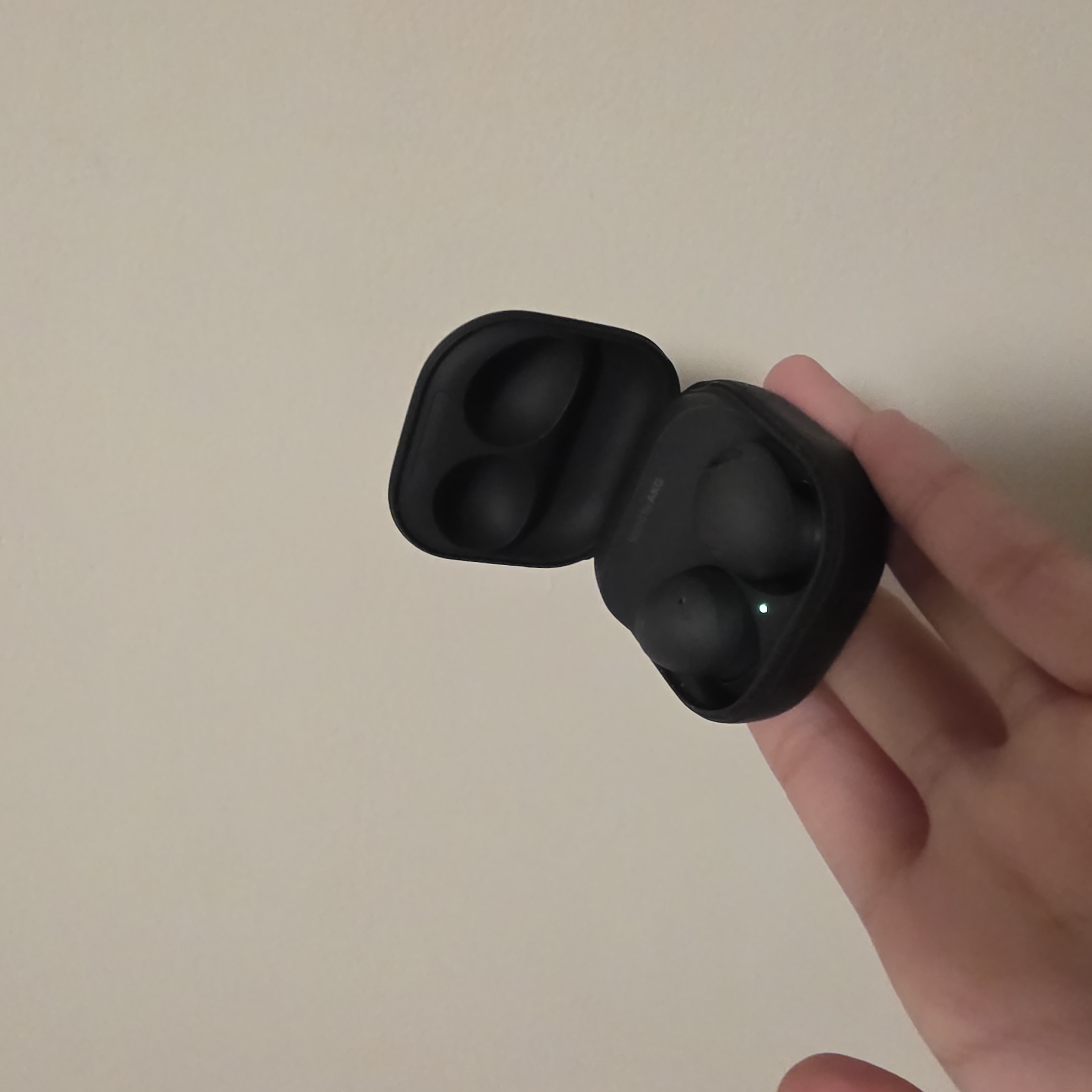 Earbuds are a wearable interaction because they involve the sensitive skin of the ear canal and tactile feedback to ensure a secure fit.